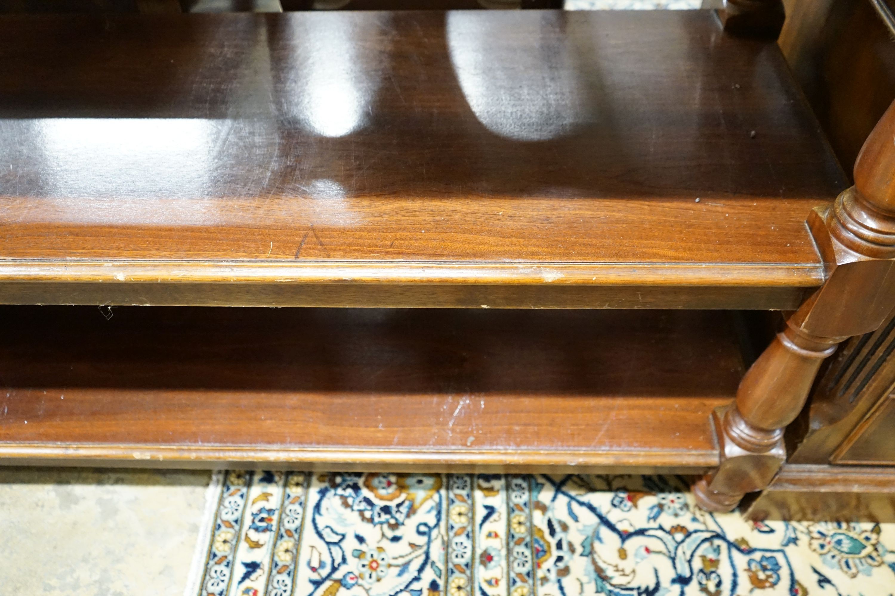 A Victorian style mahogany four tier buffet, length 136cm, depth 48cm, height 130cm